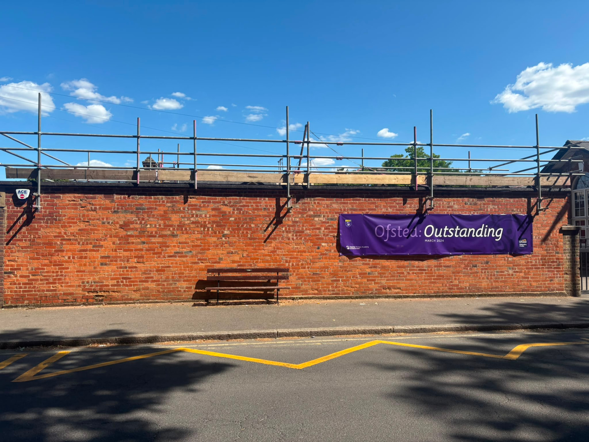 Roofing access scaffold with edge protection handrails along the roofline at Harris Primary Academy, Beckenham - Pinnacle Scaffolding