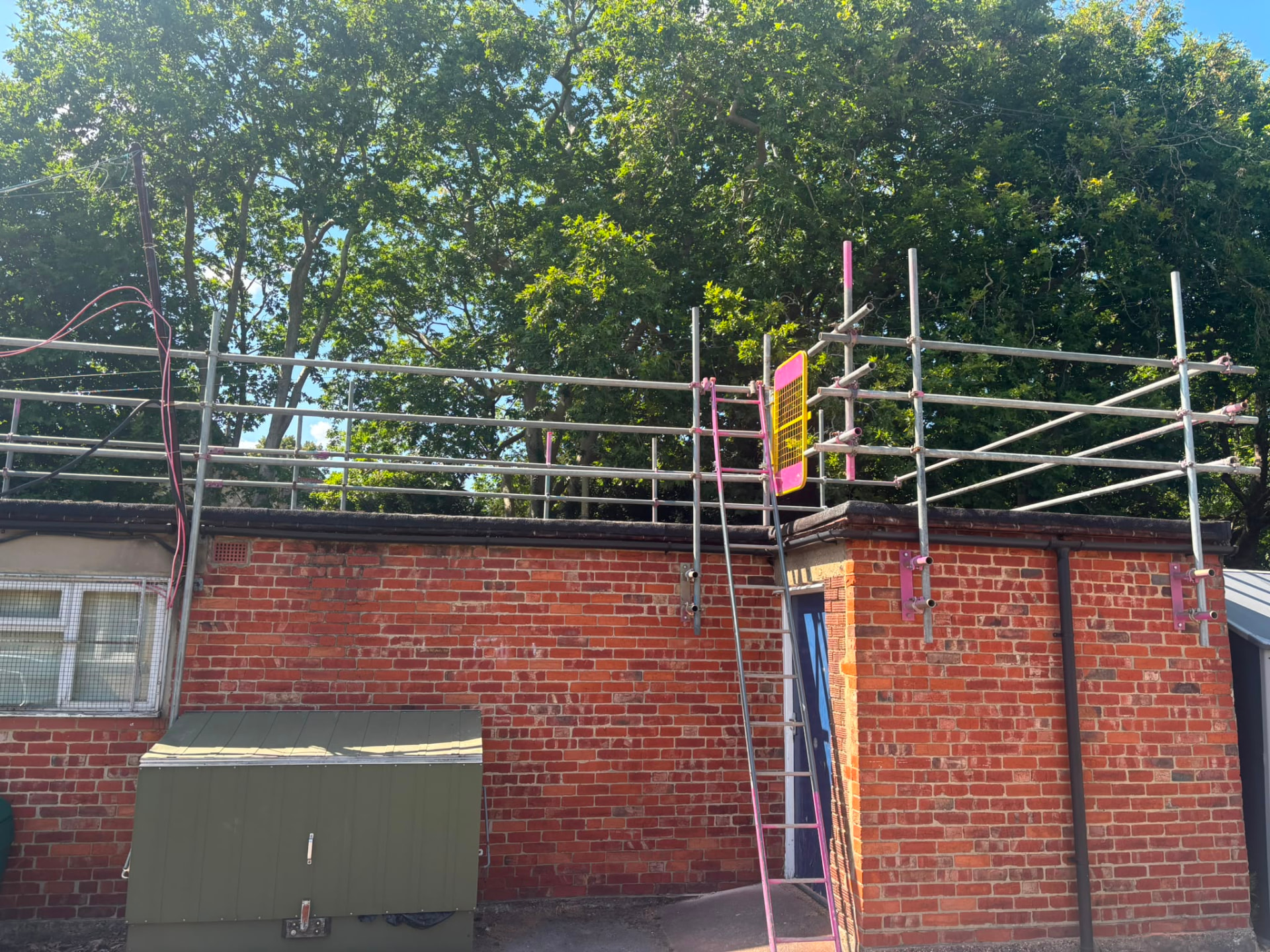 Flat roof edge protection handrails and guarded ladder access on a primary school roof in Bromley - Pinnacle Scaffolding