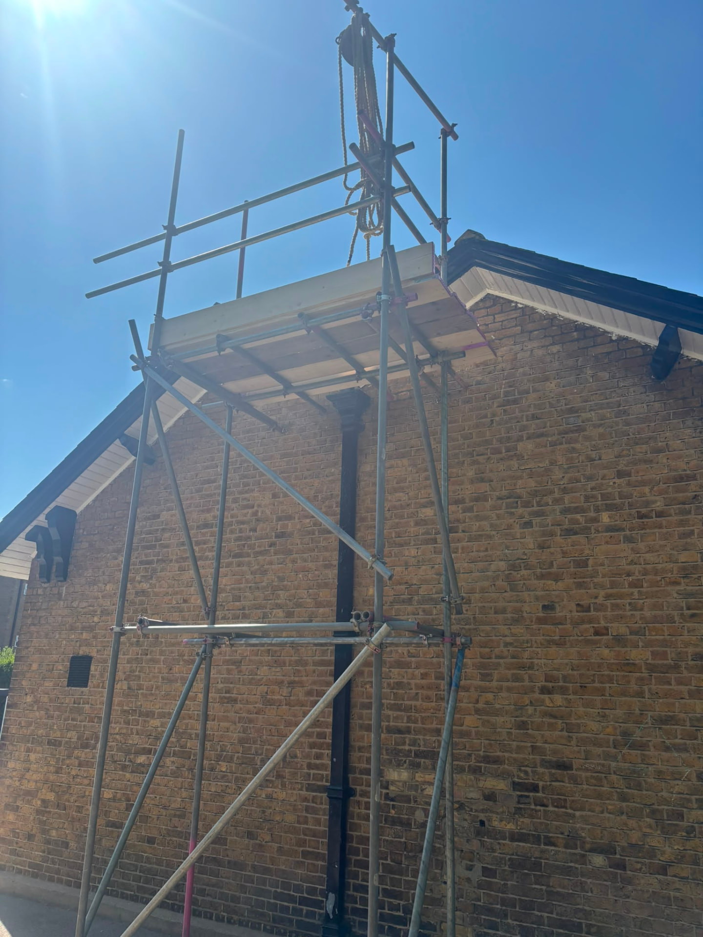Heavy duty loading bay with gin wheel rigged for lifting roofing materials at a Harris Primary Academy school - Pinnacle Scaffolding