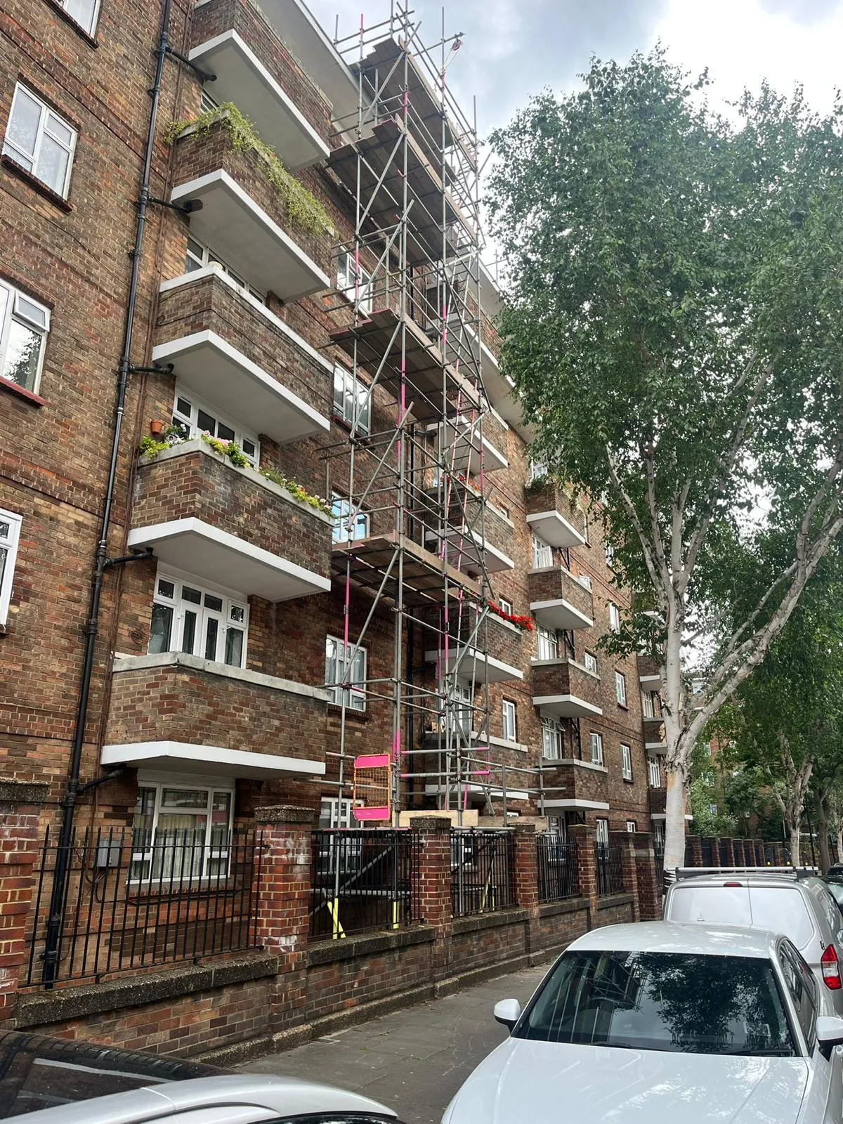 Tower block access scaffold from street level, central London estate